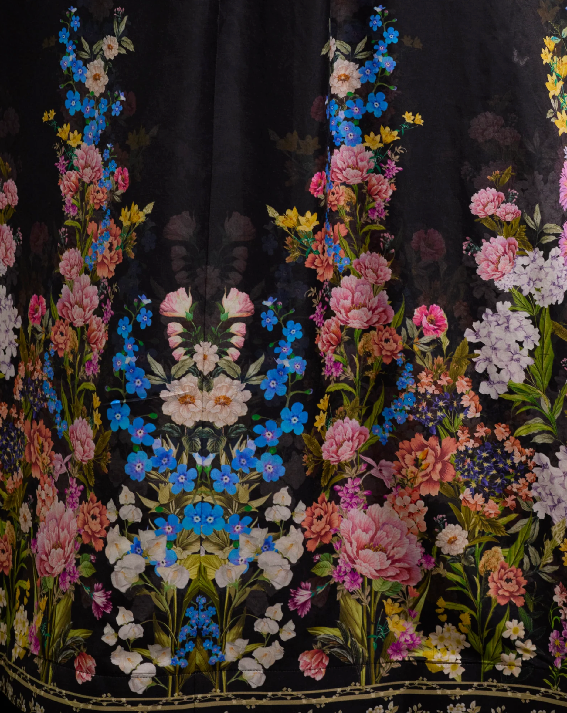 Embroidered floral pattern on black fabric